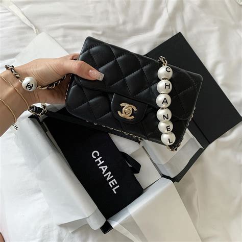 chanel pearl handbag|chanel bag with pearl chain.